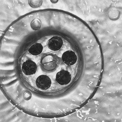 Water going down a sink drain.