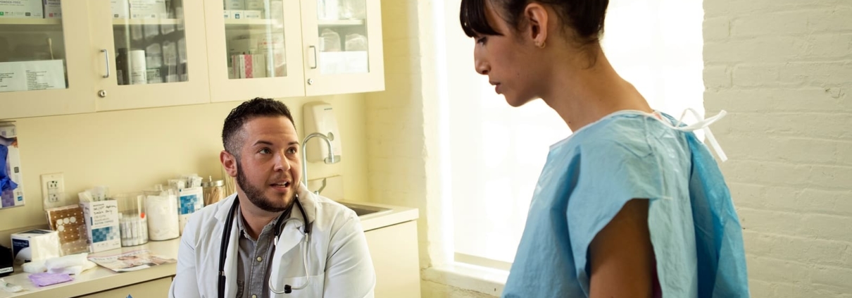 Photo of a patient speaking to a doctor