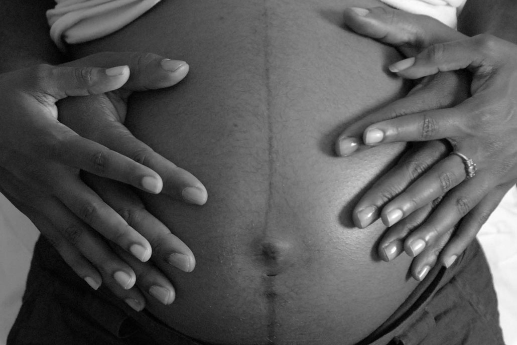 Pregnant woman's stomach.