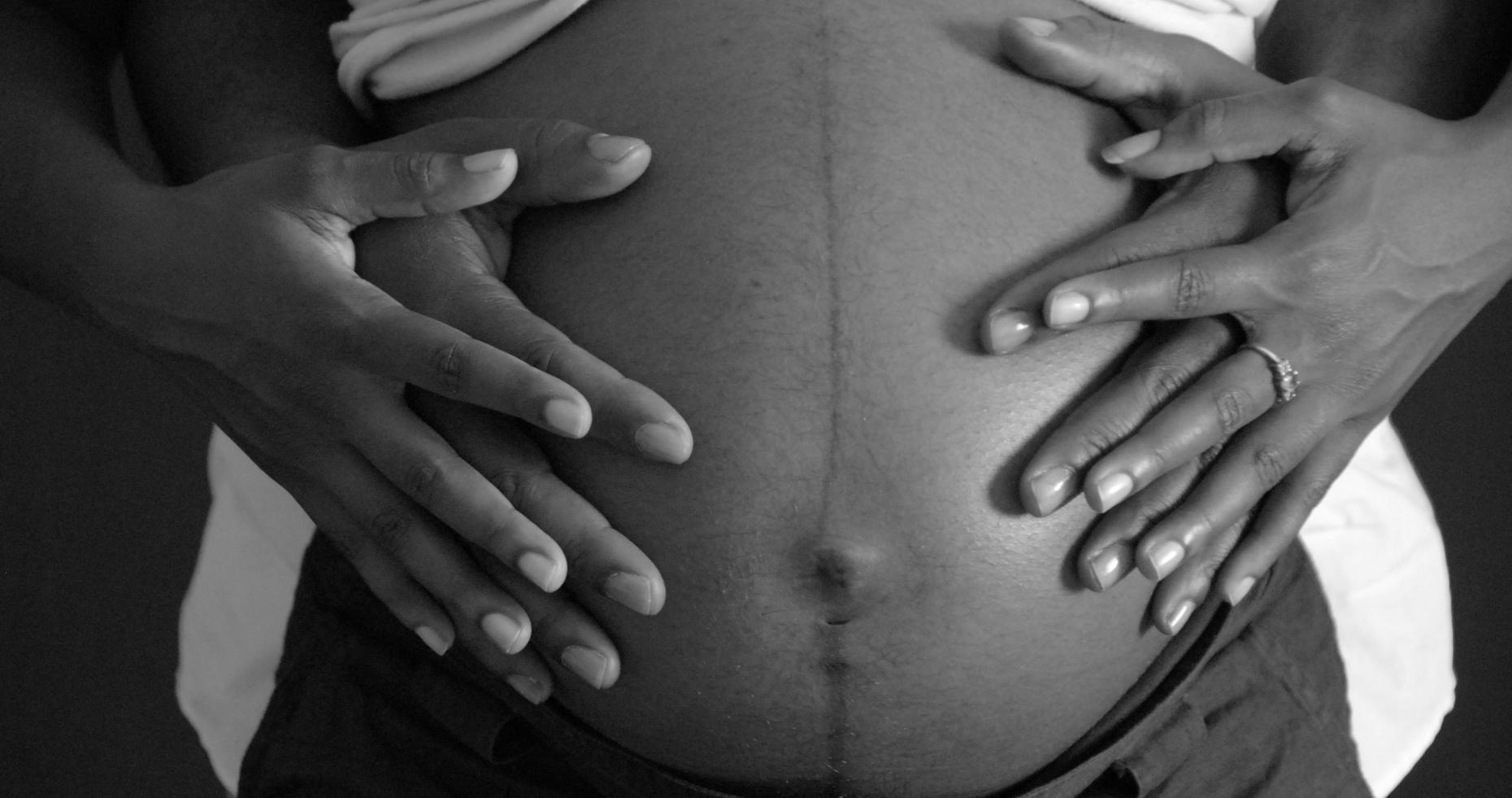 Pregnant woman's stomach.