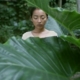 Woman in foliage from A Million Years film still.