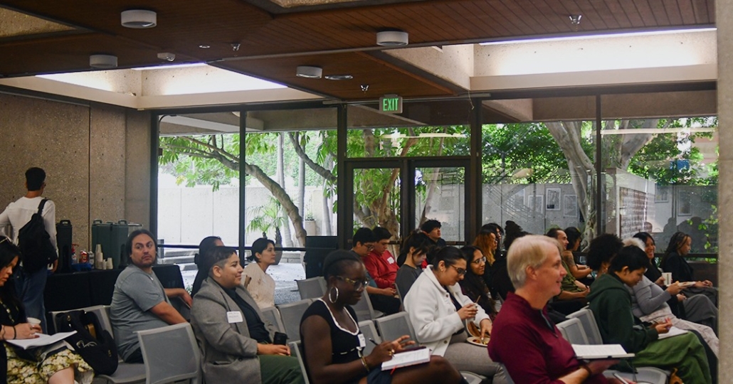 Room full of conference attendees.