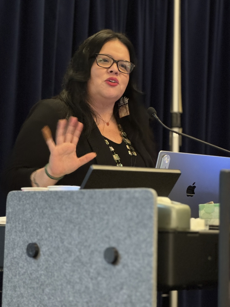 Close up of keynote speaker at the podium.
