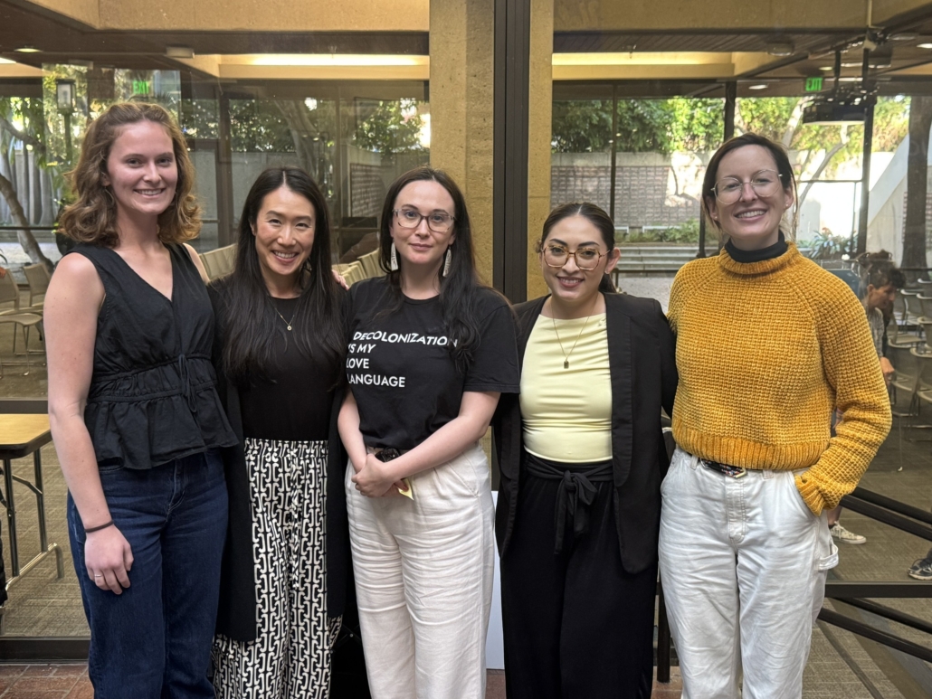 Five staff members pose for the camera.