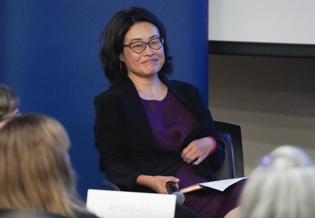 Grace Hong sitting in chair.