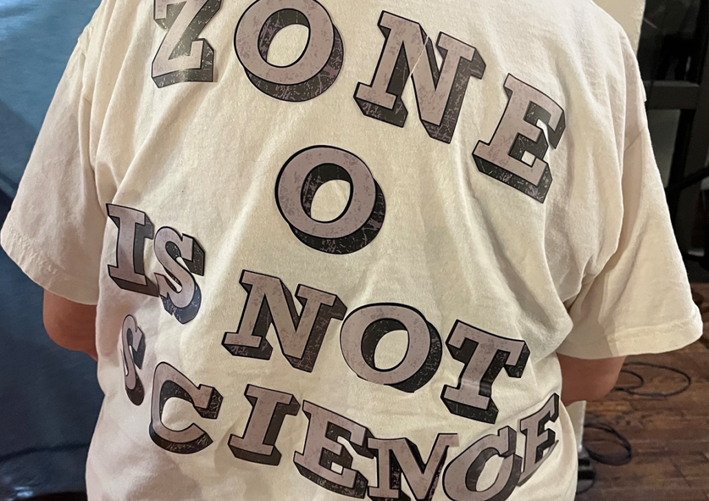 Debating Zone Zero- Gendered dimensions of wildfire mitigation, mobilization, and meaning-making in California White tee shirt with grey text on the back with the words "Zone O is not Science."